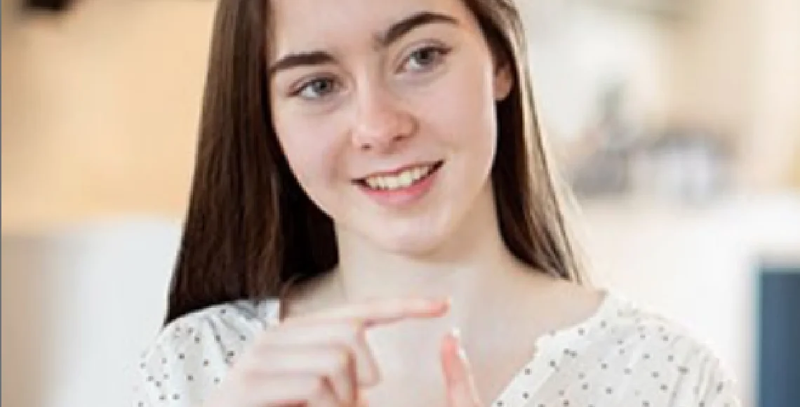 a young woman calculating her savings